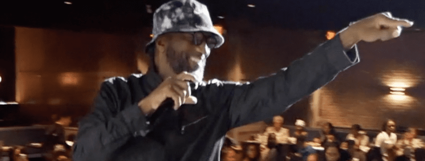 Performer pointing and engaging with audience.